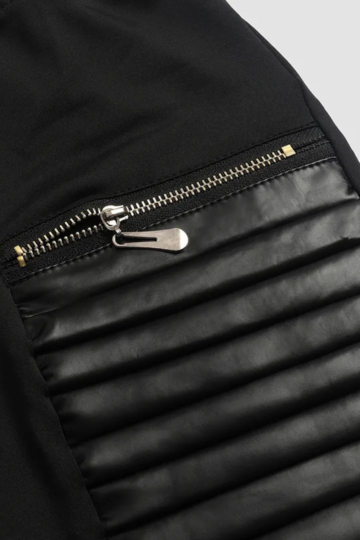 Pantalon en similicuir avec bordure contrastante et fermeture éclair